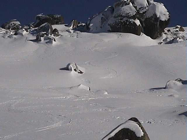 Dropping into the Basin from Karels on firm wind-packed snow