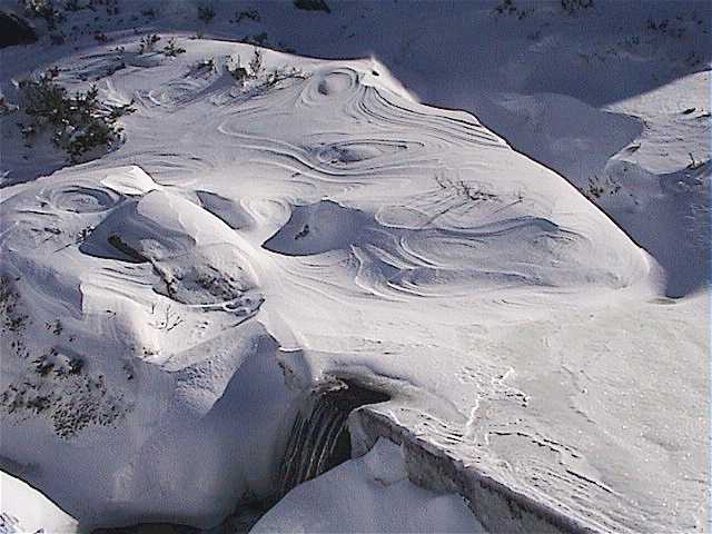 Amazing wind patterns in the snow beside Platypus Pond at the top of Gunbarrel Chair