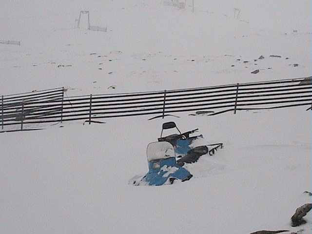 2 snow-mobiles abandoned to the snows at the top of Crackenback  Sunday morning