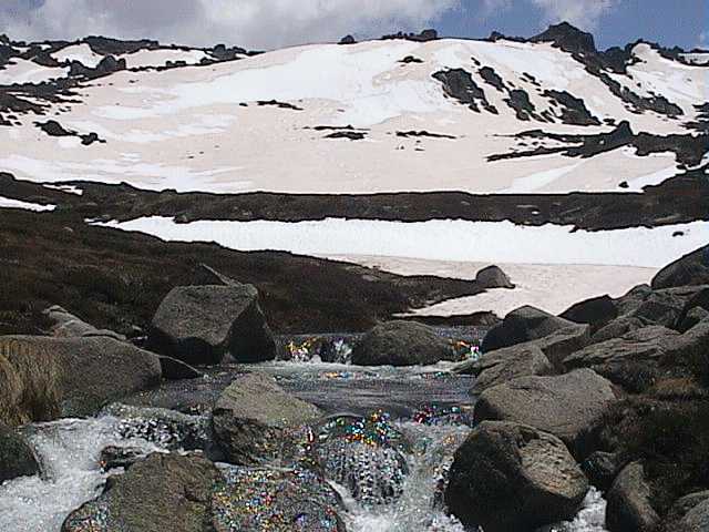 Melted parts of Signature Hill rush to join the Thredbo River