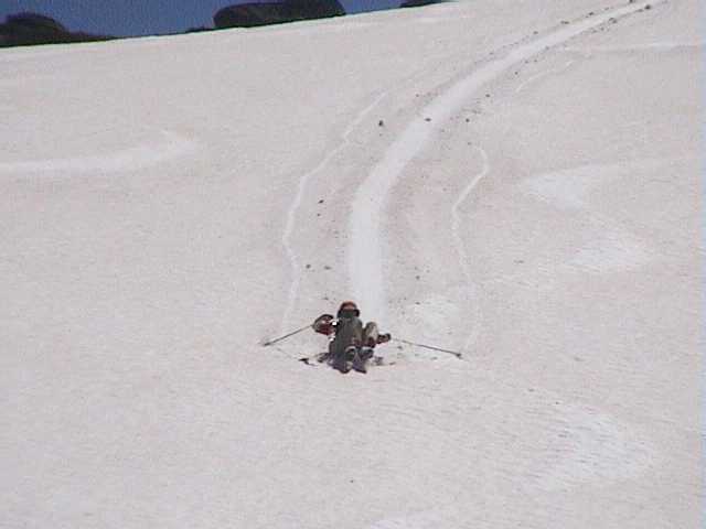 Jackie finds a faster means of descent than snowshoes