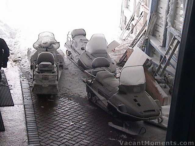 Frosted snowmobiles seeking shelter at Eagles Nest