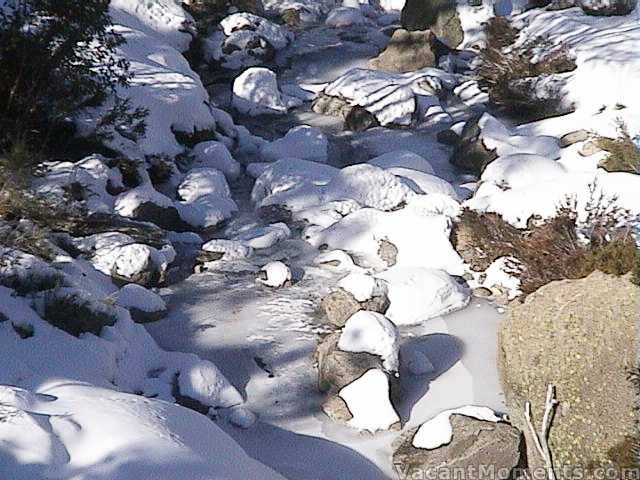 Frozen Merritts Creek below the bridge on Crackenback Traverse