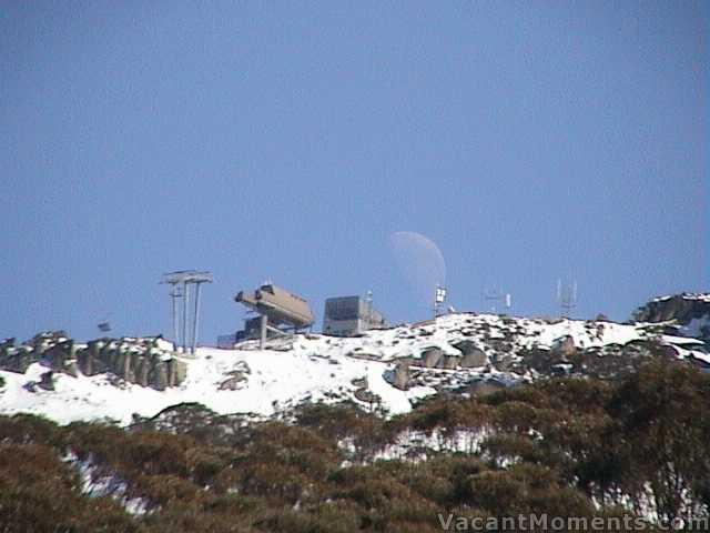 Moon setting behind Crackenback late on Sunday morning  even larger than on Friday