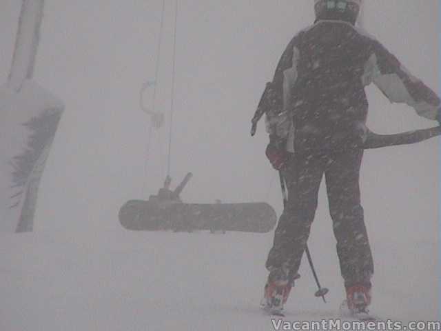 Boarder doing it the hard way up Basin T-bar