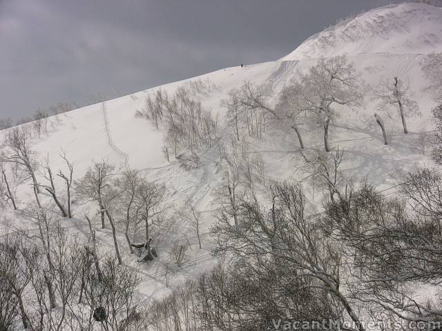 Thats a person standing above and a gondola below