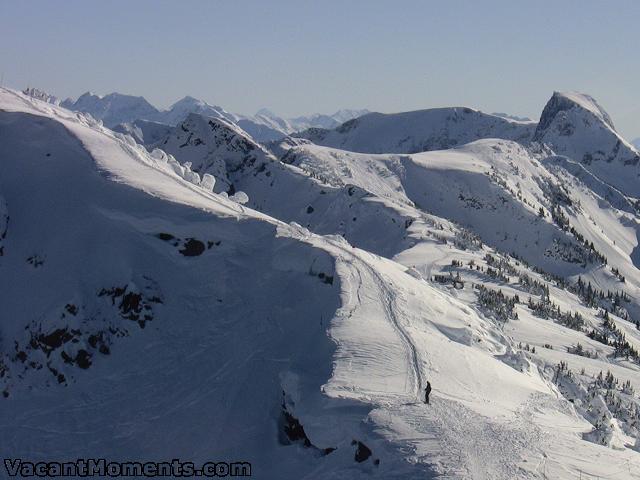 Looking to the cat skiing area and beyond the resort