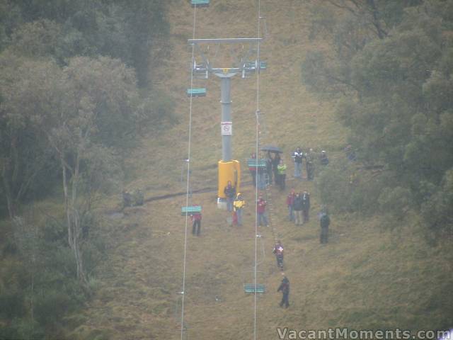 Ski Patrollers under Snowgums chair with a loooong ladder