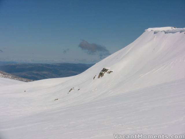 Looking south beneath the cornice on Sth Ridge<BR>Spotting a possible safe descent line