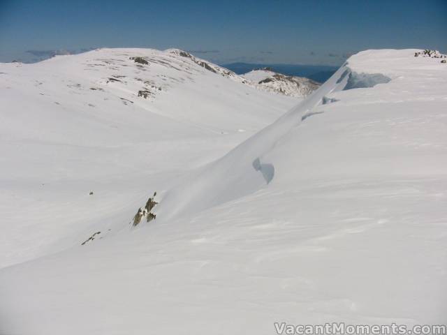 On top of the ridge, standing well back from the cornice edge