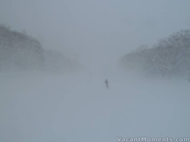 Karen disappearing into the big winds that punctuated the powder days