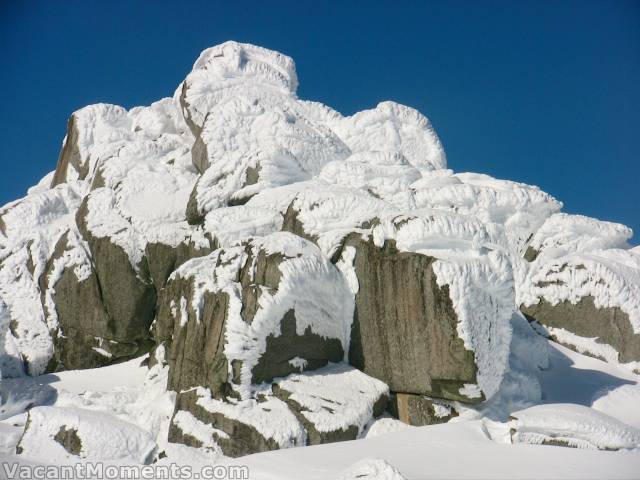 Amazing snow and ice formations highlighted against a perfect blue sky