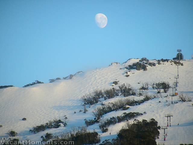 Moon over the windblown Bluff this morning