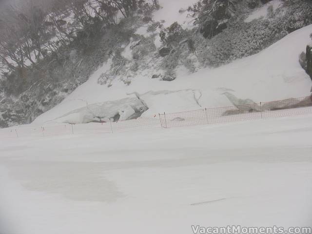 With huge blocks of ice & snow collapsing into the creek