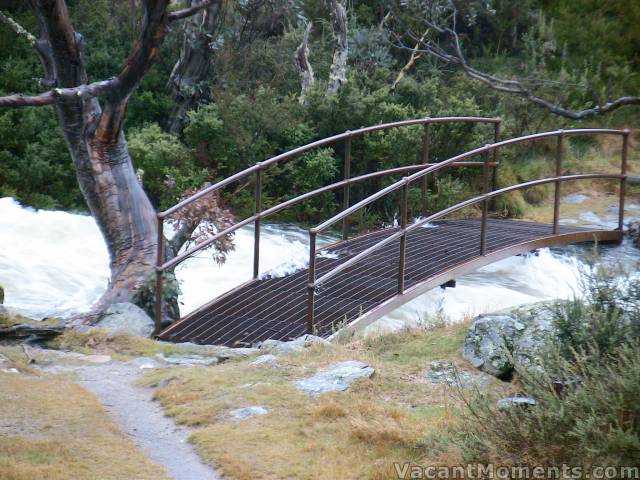 Bogong Creek with waves breaking over the bridge