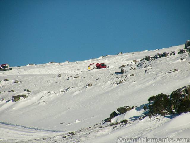 Snow cats pushing snow uphill yesterday to get Karels open today