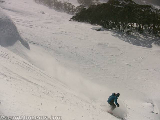 Little snow balls rolling down behind