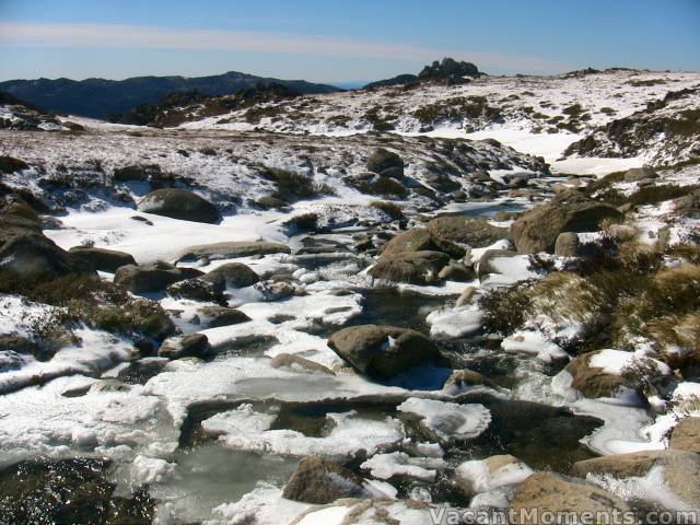 A frozen Merritts Creek from the bridge looking towards Thredbo