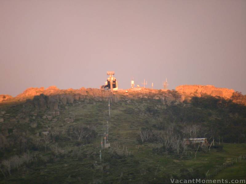 First rays on Eagles Nest with a grey/pink backdrop