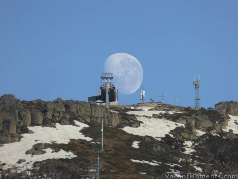 A huge moon setting behind Eagles Nest on Sunday morning