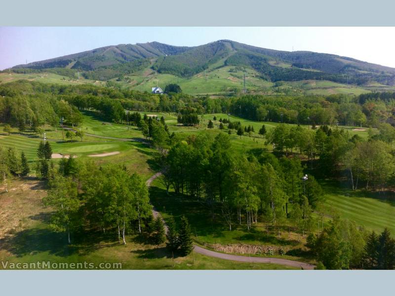 Looking across the lush greens to East Mountain and Mt Isola