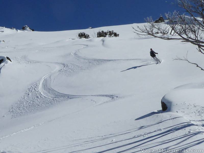 Marion skiing back down towards the tree line