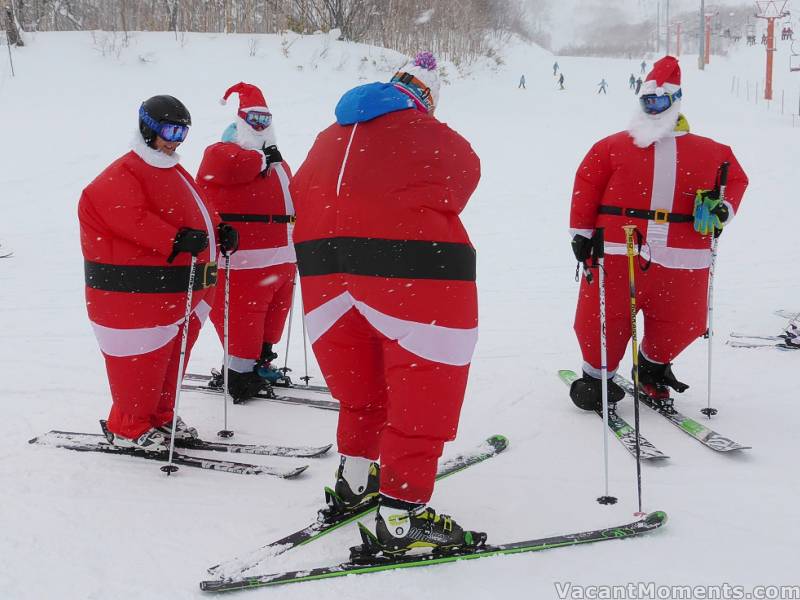 Santas, on what looks like the Family Run in Niseko<BR>Too much port and puddin' ?