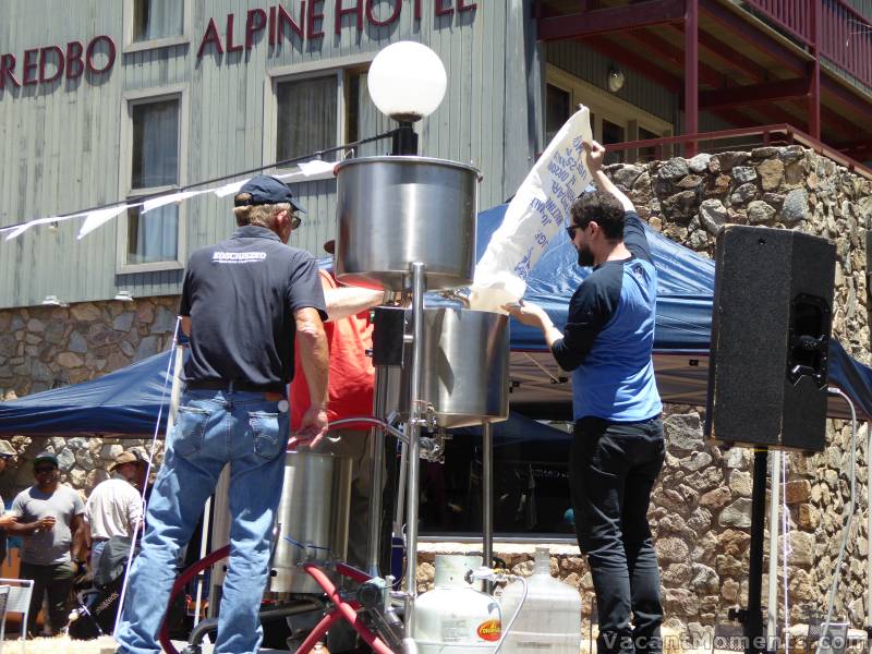 Chuck Hahn (left) and aides prepare to start brewing beer