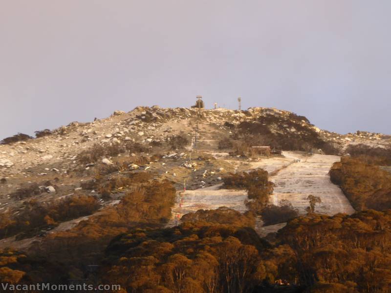 An overnight dusting and a red-tinged sunrise indicating more to come